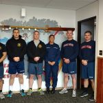 The Thanksgiving weekend staff at U.S. Coast Guard Station Quillayute River, from left, were Russell Smith, John Montenegro, Michael Laurenti, Turner Setlich, Kaya Cornejo-D&rsquo;Oyen, Matthew Pullen, Irenio Riggle, and in the window Daniel Hookaday. (Zorina Barker/for Peninsula Daily News)