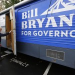 Bill Bryant, the Republican candidate for Washington state governor, boards his campaign bus Friday following a get-out-the-vote rally at a campaign office in Issaquah. (Ted S. Warren/The Associated Press)