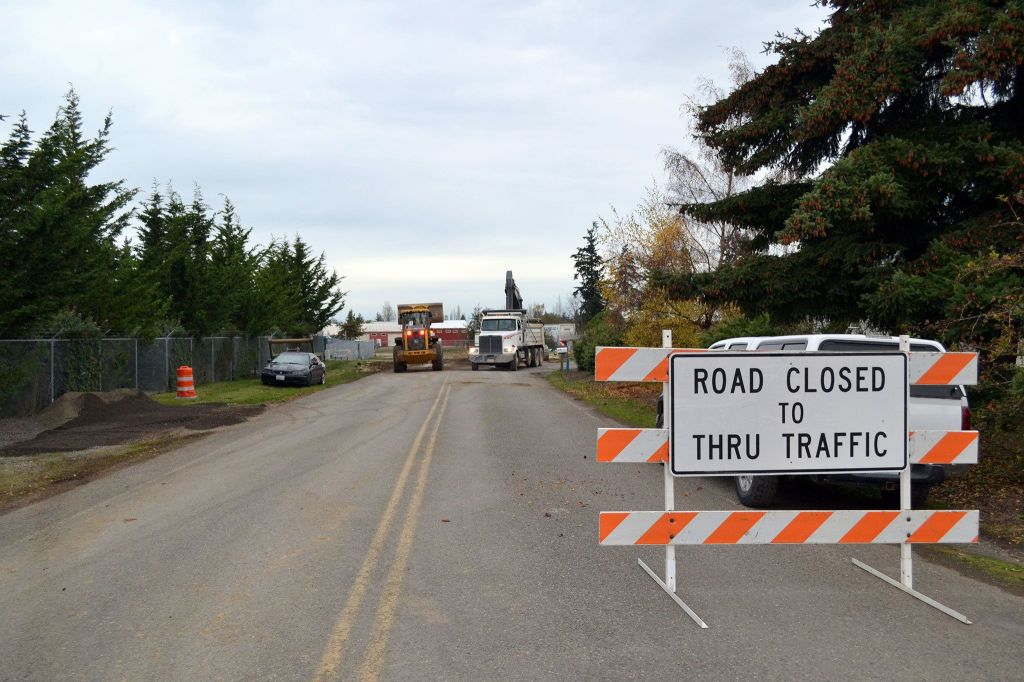 Construction crews work on a portion of Business Park Loop. Work on Carlsborg Road is tentatively set for completion in December, Clallam County officials say. (Matthew Nash/Olympic Peninsula News Group)