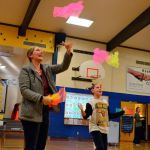 Fourth-grader Allie Rush, 9, juggles with her mom, Melissa Gatchet, during conferences at Helen Haller Elementary School to demonstrate how the Heart Tech Plus program works. It&rsquo;s one of the programs the school&rsquo;s PTO is raising funds for at the Turkey Trot. (Matthew Nash/Olympic Peninsula News Group)
