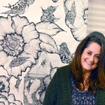 Erica McClain, a Sequim artist, stands before one of her creations. (Diane Urbani de la Paz/for Peninsula Daily News)