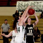 Clallam Bay&rsquo;s Molly McCoy, right, goes up for a shot against the defense of Port Angeles C Squad&rsquo;s Allison Locke. The Bruins topped the Roughriders 55-15 Wednesday at Port Angeles High School.