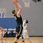 Steve Mullensky/for Peninsula Daily News Forks&rsquo; Marky Adams beats out Chimacum&rsquo;s Aidan Hartnett and goes for an easy lay-up during a game against Chimacum on Friday in Chimacum.
