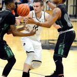 Rick Ross/Peninsula College Peninsula&rsquo;s Trent Warren fights out of a Green River double-team in the Pirates&rsquo; 82-76 win over the Gators Saturday night.