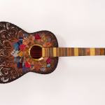 This guitar, decorated by Teri LaDow, will be on display from 5:30 p.m. to 7:30 p.m. Saturday at Studio Bob, 118 1/2 E. Front St., as part of the 2nd Weekend Art Event. (Juan de Fuca Foundation)
