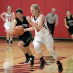 Steve Mullensky/for Peninsula Daily News                                Port Townsend&rsquo;s Jaz Apker-Montoya, 2, races past Klahowya&rsquo;s AmberBumbalough during the Redhawks&rsquo; 54-50 home victory.