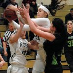 Keith Thorpe/Peninsula Daily News Port Angeles&rsquo; Kiana Robideau, top, slips past teammate Lauren Lunt, left, and Peninsula&rsquo;s Taryn Richter in first-quarter action on Saturday in Port Angeles.