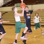 Dave Logan/for the Peninsula Daily News Wyatt Hall of the Port Angeles eighth-grade boys&rsquo; team drives to the basket against the Drive.
