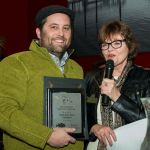 Danny McEnerney of the Rockfish Group accepts his Main Street Champion Award from Main Street director Mari Mullen. (Deja View Photography)