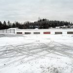 Concrete barriers and a steel gate block access to a large vacant lot along U.S. Highway 101 at Fey Road west of Port Angeles. (Keith Thorpe/Peninsula Daily News)