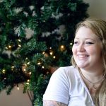 Anastasia Webster smiles in her new home after her family received enough from the Peninsula Home Fund to add to their savings and have enough for a deposit. (Diane Urbani de la Paz/for Peninsula Daily News)