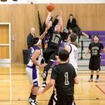 Steve Mullensky/for Peninsula Daily News                                Clallam Bay&rsquo;s Ryan McCoy, 12, goes up of a basket during a game played against the Quilcene Rangers on Monday in Quilcene.