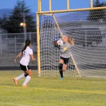 Matthew Nash/Olympic Peninsula News Group Sequim&rsquo;s Claire Henninger (with ball) makes a save during an early-season contest.