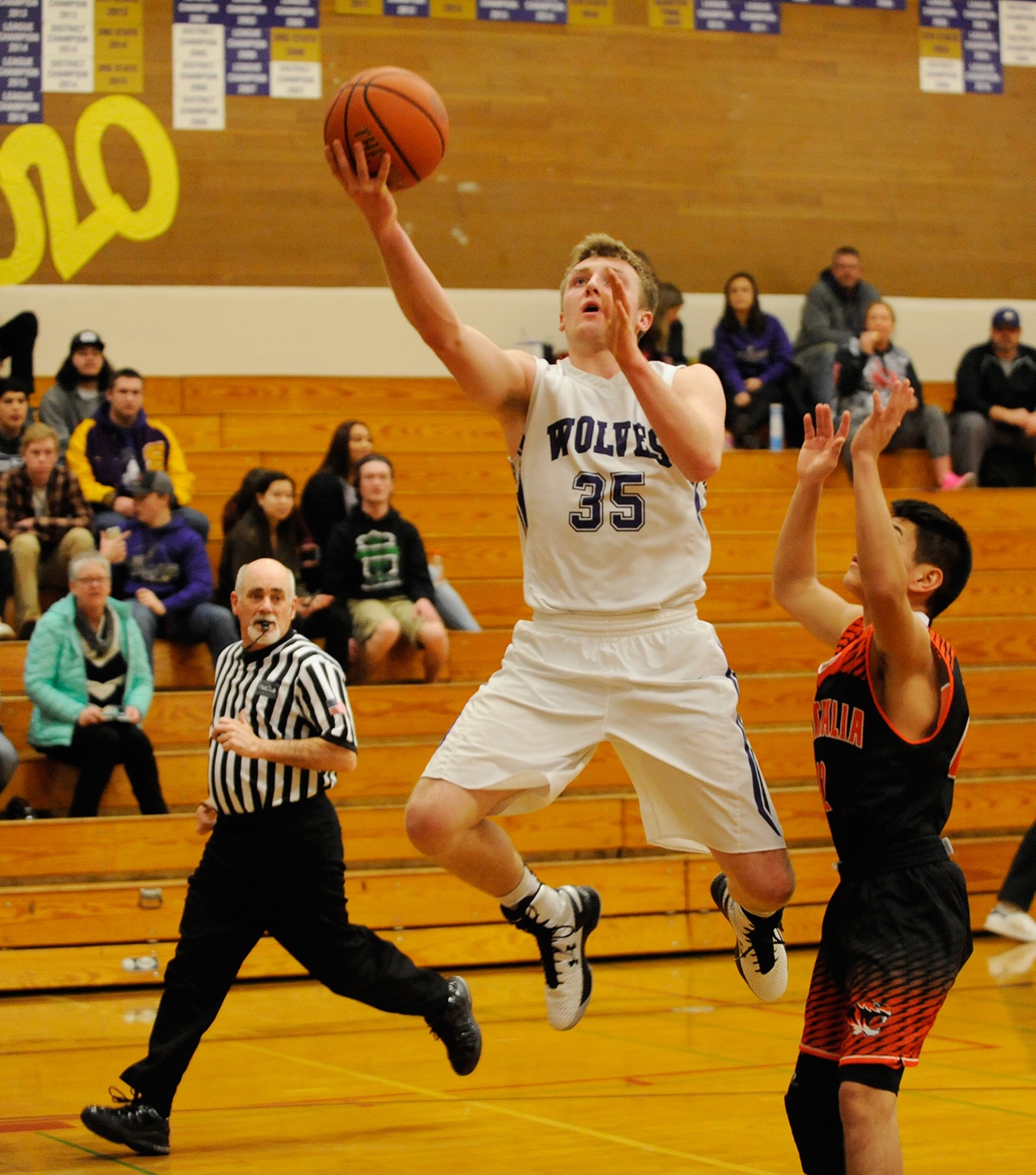 Michael Dashiell/Olympic Peninsula News Group Sequim&rsquo;s Riley Cowan, left, puts up a layup during the Wolves&rsquo; 60-45 loss to Centralia.                                Michael Dashiell/Olympic Peninsula News Group Sequim&rsquo;s Riley Cowan, left, puts up a layup during the Wolves&rsquo; 60-45 loss to Centralia.