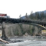 The Elwha River flows beneath the U.S. Highway 101 bridge west of Port Angeles on Wednesday as the state considers plans for replacing the aging structure. (Keith Thorpe/Peninsula Daily News)
