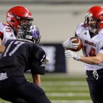 The Associated Press Neah Bay&rsquo;s Cameron Buzzell, right, runs the ball as Nate Tyler (20) blocks Odessa-Harrington&rsquo;s John DeWulf during the Red Devils&rsquo; 64-34 Class 1B state championship victory.