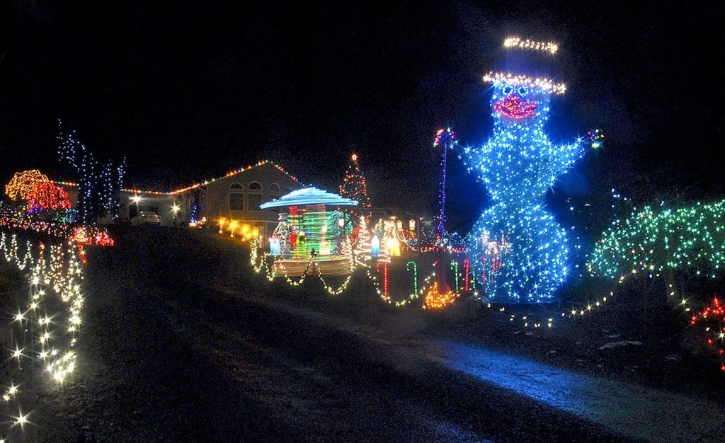 A giant snowman is one of dozens of illuminated holiday decorations available for viewing around a circle drive at 1521 S. O St., in Port Angeles. (Keith Thorpe/Peninsula Daily News)