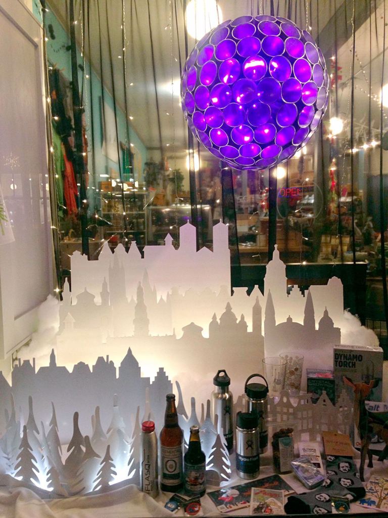 With a cityscape and glowing orb, Getables in Port Townsend got creative with its holiday window display. (Cydney McFarland/Peninsula Daily News)