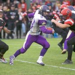 Steve Mullensky/for Peninsula Daily News The season started with a thriller between Gavin Velarde&rsquo;s (23) Sequim Wolves and the Port Townsend Redhawks.