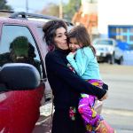 Amilalupe Aguilar and her daughter Macha, 5, reunite with their Chevy Blazer following extensive repairs done at Peninsula College&rsquo;s auto shop. (Diane Urbani de la Paz/for Peninsula Daily News)