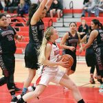 Steve Mullensky/for Peninsula Daily News Port Townsend&rsquo;s Kaitlyn Meek keeps here eyes on the basket while driving for a score during the opening match-up of the 2016 Crush in the Slush against the Wahluke Warriors at Port Townsend High School on Thursday.