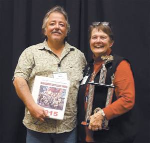 Clallam County Fire District Commissioners Ben Pacheco, left, and Donna Buck accept the first-place trophy for the Washington Fire Commissioners Association&rsquo;s Management Excellence Award. (Clallam County Fire District No. 4)