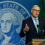 Gov. Jay Inslee talks to reporters about his proposed budget in Olympia last Friday. Inslee will try to convince lawmakers to do something voters wouldn&rsquo;t last month: approve a new tax on carbon emissions from fossil fuels. (Ted S. Warren/Associated Press)