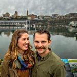 Gig Harbor sweethearts Mattie and Jake Harrison pose for a photo along the Thea Foss waterway in Tacoma last month. (David Montesino/The News Tribune via AP)