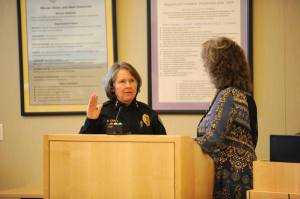 Matthew Nash/Olympic Peninsula News Group                                Sheri Crain, new police chief for the city of Sequim, takes an oath for the position from Sequim city clerk Karen Kuznek-Reese last Friday in the Sequim City Council&rsquo;s chambers.
