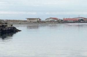 Construction of a new Navy pier at Ediz Hook along the shoreline of Coast Guard Air Station/Sector Field Office Port Angeles will be delayed until July. (Paul Gottlieb/Peninsula Daily News)