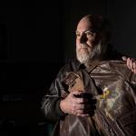 Greg Staples holds his father&rsquo;s vintage flight jacket in his office in north Spokane. Maj. Donald Staples died in a B-52 crash Sept. 8, 1958, near Fairchild Air Force Base. (Dan Pelle/The Spokesman-Review via AP)