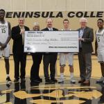 From left are Pirates&rsquo; basketball player Omar Lo, Athletic Director Rick Ross, Tami Rose and Dan Wilder Jr. from Wilder Auto, basketball player Jalon McCullough, Peninsula College President Dr. Luke Robins and basketball player Darrion Daniels. The donation to the Pirate Athletic Association will go toward supporting athletic scholarships.