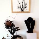 A necklace made by Kathy Schreiner, displayed on the bust at right, will be available for viewing during First Friday Art Walk in Sequim.