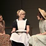 In a scene from the play &ldquo;The Diviners,&rdquo; Norma, played by Tiara Delatorre, left, and Madison Millet as Luella, at right, tell cafe owner Goldie, played by Hannah Black, of a curious encounter with the town&rsquo;s recent visitor, Pastor C.C. Showers. (Port Angeles High School)