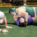 Dave Logan/for the Peninsula Daily News                                Port Angeles&rsquo; 220-pound Mason Coppage has position on his North Kitsap opponent Josh Snider. Coppage won by a pin.