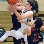 Keith Thorpe/Peninsula Daily News                                Port Angeles&rsquo; Luke Angevine, center, pulls down a rebound surrounded by Kingston&rsquo;s Andrew Shaw, rear, and Isaac Anderson, front, in the second quarter of the Riders&rsquo; 68-46 loss to the Buccaneers.