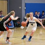 Steve Mullensky/for Peninsula Daily News Chimacum&rsquo;s Mechelle Nisbet drives downcourt into the defense of Port Townsend&rsquo;s Kaitlyn Meek during an Olympic League 1A rivalry contest.