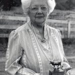 Josephine Yarr in 1988 holds an award received for dairy cow milk production. (Jefferson County Historical Society)
