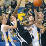 Keith Thorpe/Peninsula Daily News                                In a scramble under the hoop, Peter Johnson of Crescent, Jamari Signor of Clallam Bay, Wyatt McNeece of Crescent and Ryan McCoy of Clallam Bay fight for a rebound in the second quarter on friday at Crescent High School in Joyce.