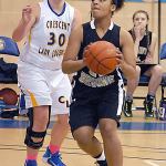 Keith Thorpe/Peninsula Daily News Clallam Bay&rsquo;s Atokena Abe, right, drives to the lane past Crescent&rsquo;s Alyssa Hutto in the fourth quarter on Friday night in Joyce.