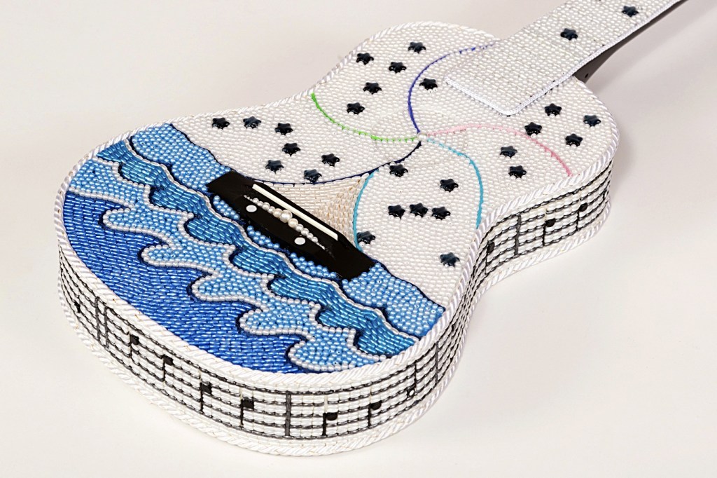 Artist Sherilyn Seyler&rsquo;s Beaded Bay electric guitar won third place during the Favorite Strings vote done at Studio Bob in December. (Juan de Fuca Foundation)