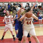 Steve Mullensky/for Peninsula Daily News                                PortTownsend&rsquo;s Izzy Hammett looks for someone to pass the ball to while being guarded by Chimacum&rsquo;s Shanya Nisbet during the Cowboys&rsquo; 42-28 win over the rival Redhawks.