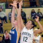 Keith Thorpe/Peninsula Daily News Bremerton&rsquo;s Sophia Smith, left, and Port Angeles&rsquo; Cheyenne Wheeler fight for a rebound in the second quarter on Friday night at Port Angeles High School.