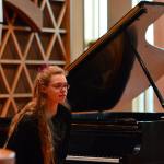 Emma Weller, 14, of Port Angeles leans forward to hear comments from the Junior Young Artist Competition judges in Port Angeles on Saturday.