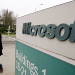 A man walks on the Microsoft headquarters campus in Redmond in 2009. The Justice Department is asking a federal judge to throw out a lawsuit filed by Microsoft that seeks to quash a law allowing the government to demand customer data stored electronically while prohibiting Microsoft from exposing the requests. (AP Photo/Elaine Thompson, File)