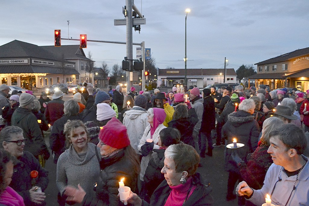 Matthew Nash/Olympic Peninsula News Group                                People gather last Saturday at the southeast corner of Washington Street and Sequim Avenue for women&rsquo;s rights. Organizers estimate more than 100 people attended.