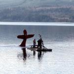 A downed plane in Discovery Bay is towed to shallow water by a commercial vessel that responded to the scene. (East Jefferson Fire-Rescue)