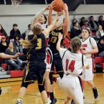 Lonnie Archibald/for Peninsula Daily News Forks&rsquo; Jayden Olson (3) and Rian Peters (13) vie for a rebound with Neah Bay&rsquo;s Cei&rsquo;J Gagnon, Cheyanna Svec (14) and Tristin Johnson (23).