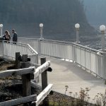 Karan Ivy of Chicago and Steve Spoor of Renton examine an information placard on the Glines Canyon Overlook in the recently reopened Elwha Valley in Olympic National Park on Thursday. (Keith Thorpe/Peninsula Daily News)