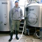 Port Townsend Brewing head brewer Carter Camp has been infusing beer for roughly two weeks to prepare a strange brew for Strange Brewfest. (Cydney McFarland/Peninsula Daily News)